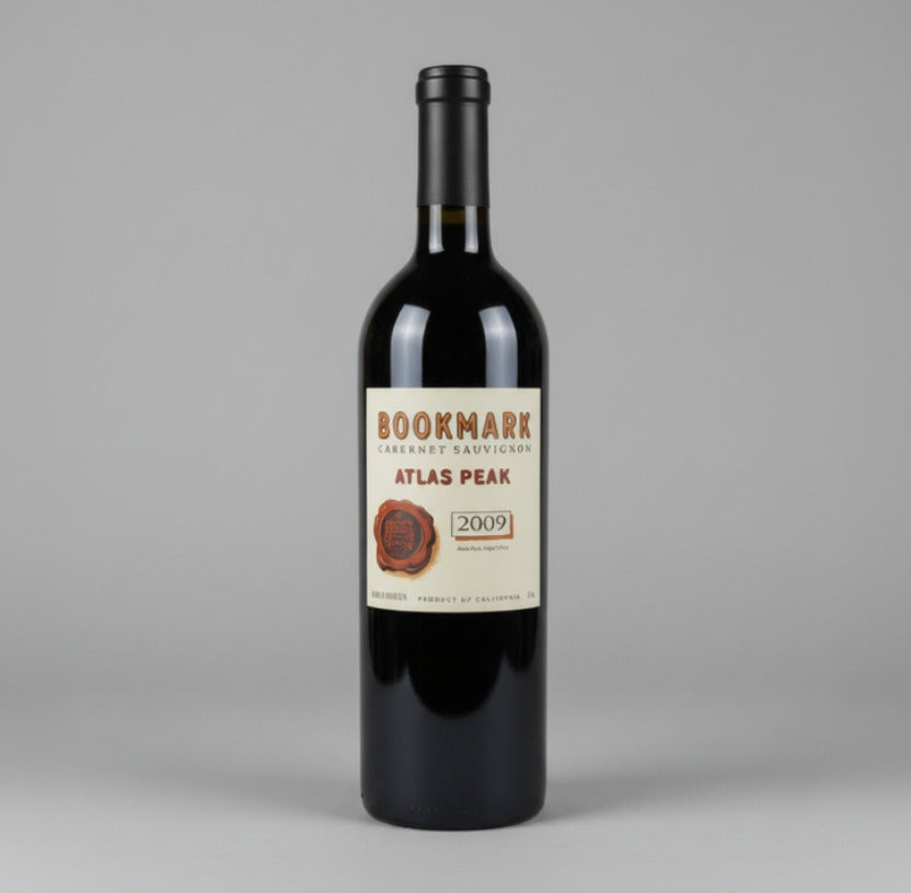 A bottle of Bookmark Atlas Peak Red Wine with a white background.