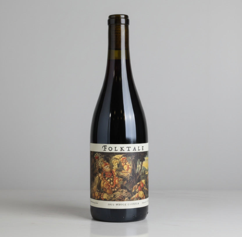 A bottle of Folktale Whole Cluster Pinot Noir with a white background