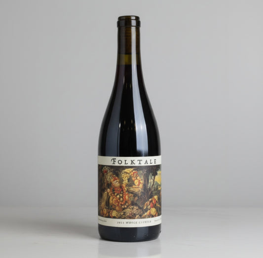A bottle of Folktale Whole Cluster Pinot Noir with a white background