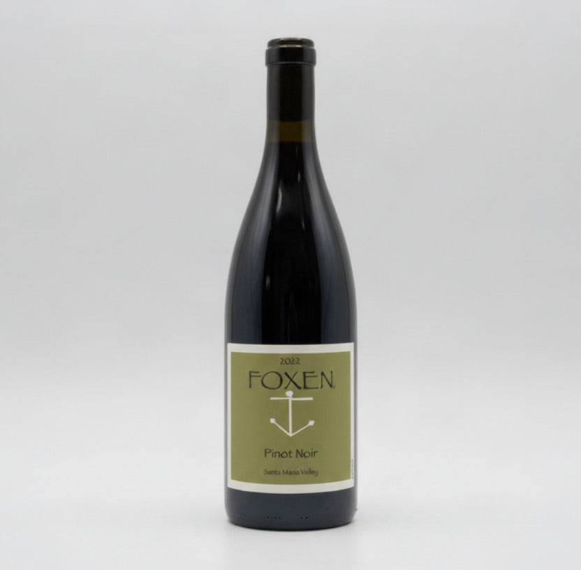 A bottle of Foxen 2022 Pinot Noir red wine, featuring a dark glass bottle with a light olive green label and a black neck foil, set against a plain white background.