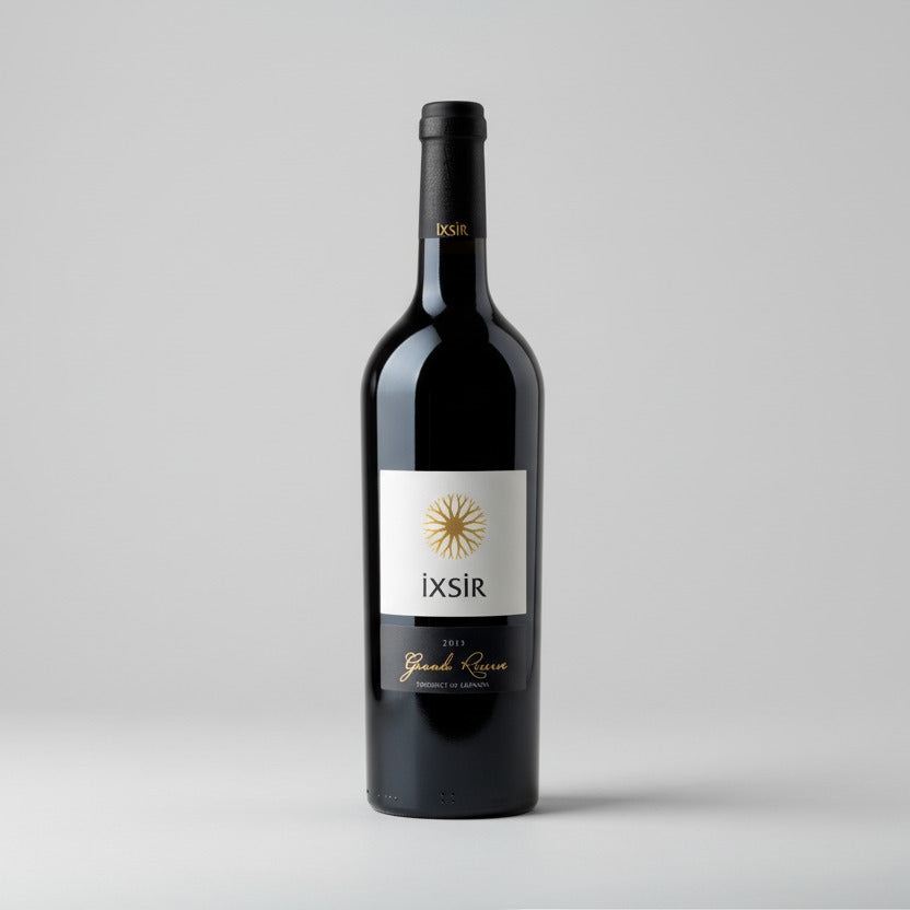 Bottle of IXSIR Grande Reserve Red Blend on a white background