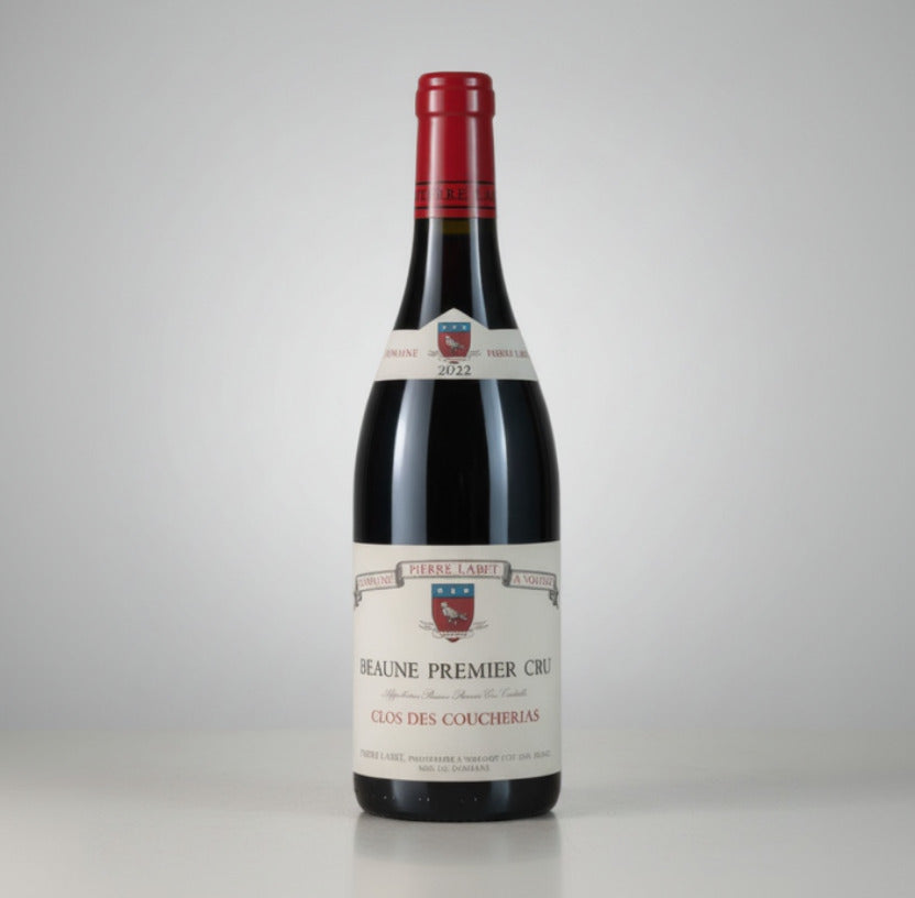 Red wine bottle with a visible label on a white background