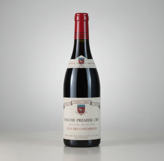 Red wine bottle with a visible label on a white background